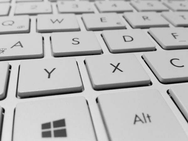 Close-up of white computer keyboard - Copy Trading