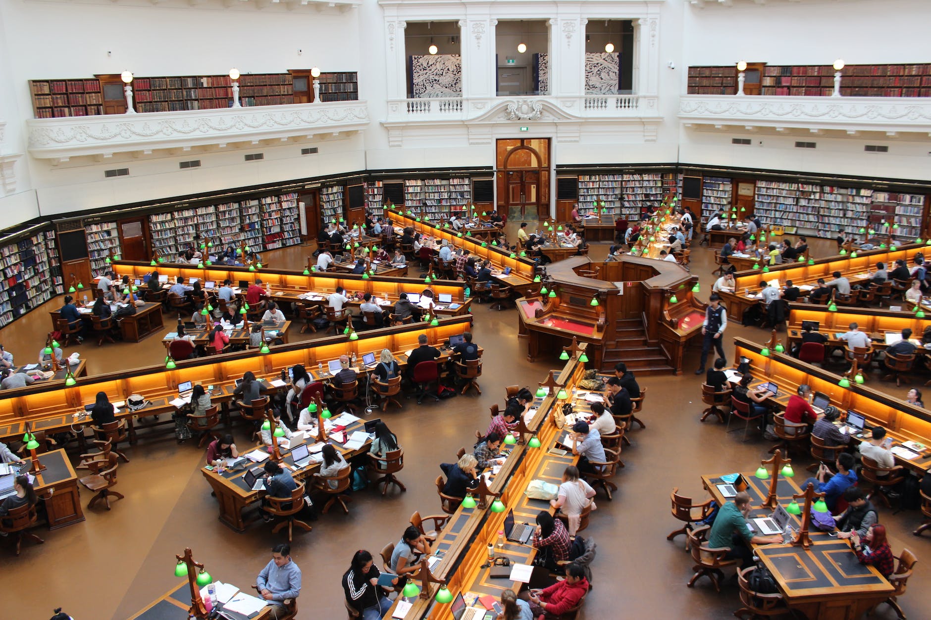 people sitting inside well lit room Dow Jones Commodity Index